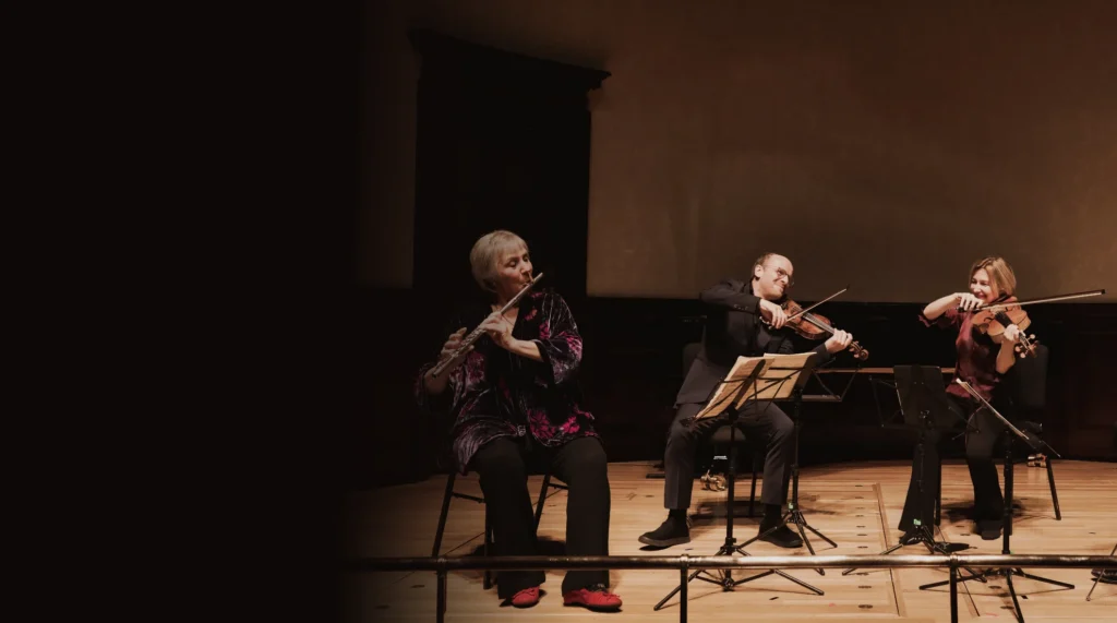 Benjamin Nabarro on violin, Philippa Davies on flute and Rachel Roberts on viola performing with The Nash Ensemble